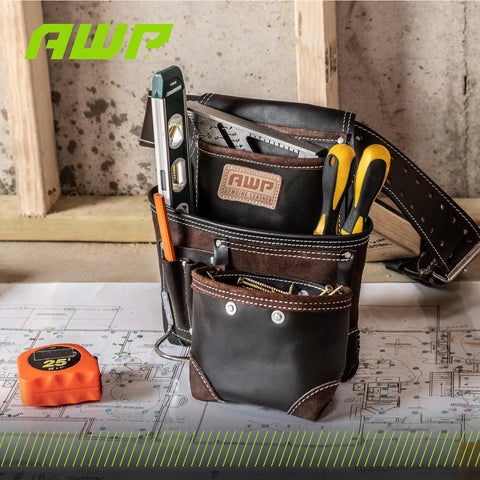 TrapJaw Oil Tan Leather Tool Pouch With Front Access displayed with tools in a workshop setting, Model 1L-995-1.