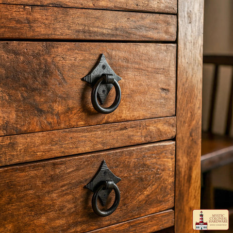 Mystic Colonial Cast Iron Ring Pull Handles With Screw Blackened Hammered Finish on wooden cabinet drawers for rustic style