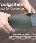 Person holding Pro Grade Hand Hoe Garden Tool For Weeding Digging And Planting With Forged Steel Blade in leather cover.