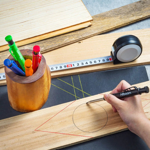 Using Mechanical Carpenter Pencil Set With Built In Sharpener And Long Nose Tip for precise scribing on wood with tape measure nearby.