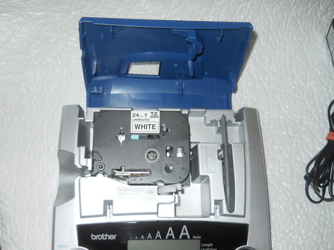 PTouch 2300 Labeling System No Fuss Stand Alone Label Maker With PC Compatibility shown open, displaying tape cartridge compartment.