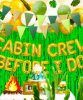 Before I Do Cabin Crew Bachelorette Party Sign Banner with balloons and cake for camping and mountain getaway celebrations.