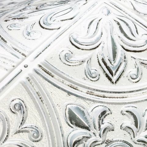 Close-up of White Tin Peel and Stick Tile Backsplash Kit with Self Adhesive Tiles, Victorian design, 3D embossed pattern.