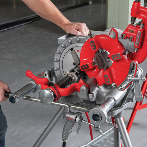 Model 300 Power Drive Complete Pipe Threading Machine, 38 RPM, shown with alloy die heads, oiler, stand, and tray in a workshop