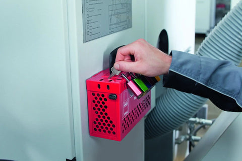 Person using key for Green 72 40 Lockout Tagout Padlock With 1 Inch Shackle 12 Pack Keyed Alike 24 Keys OSHA Compliant