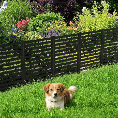 Dog sitting in front of No Dig Plastic Fence Panels 12 Pack Outdoor Privacy Fence Screen For Yard Patio Garden Beds Dual Purpose Dog Fencing AC Unit Hider Black Weatherproof Shield