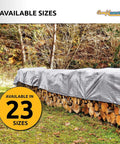 Heavy Duty 12 By 25 Foot Silver And Black Waterproof UV Blocking 10 Mil Poly Tarp covering stacked firewood outdoors
