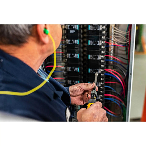 Person using Go-To Quarter Inch Drive Torque Screwdriver with Locking Collar for Precise Settings on electrical panel