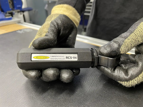 Person holding a Hard Cable Jacket Strippers For Pros Portable Electrician Tool for precise jacket removal, ergonomic handle visible