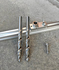 Heavy Duty M2 HSS Countersink Step Drill Bits Pack Of Two With Anti Walk Split Point For Smooth Glides And Zero Skip Action On Stainless Steel Aluminum And Hardwood on a workbench.