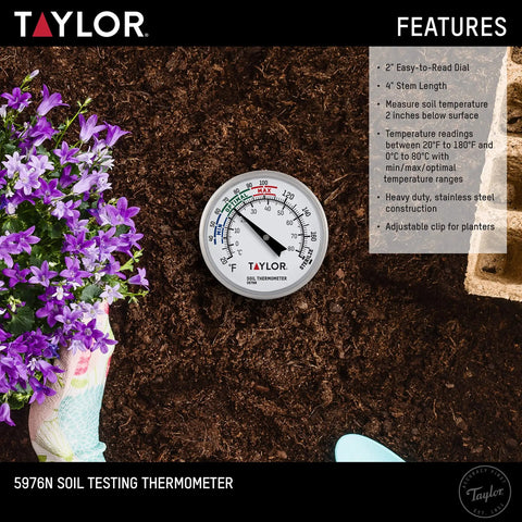 Close-up of Soil Temperature Thermometer With 4 Inch Stem For Plant Care And Lawn Garden Monitoring on soil next to flowers
