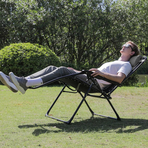 Oversized Padded Zero Gravity Lounge Chair With Cup Holder Foldable Patio Recliner For Camping Yard And Outdoor Use Built With Heavy Duty Steel Frame And Cushioned 600D Oxford Fabric Supports Up To 350 Lbs Black in use on grass