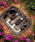 Replacement Solenoid For CP DV ASVF DAS JTV Series Valves Black installed in irrigation valve box surrounded by flowers.