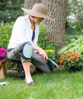Woman using Premium Garden Rocker With Cushion, Cover And Pockets For Easy Weeding And Planting Tool, Ergonomic, Model GB1227 outdoors