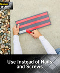 Hands applying Outdoor Mounting Tape Two Roll Pack 1 Inch By 60 Inch Each Holds Up To 15 Lbs on a surface next to rocks.