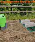 Heavy Duty Lawn Leveler Rake With 72 Inch By 10 Inch Size and chain attached to ATV in garden setting