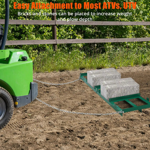 Heavy Duty Lawn Leveler Rake With 72 Inch By 10 Inch Size and chain attached to ATV in garden setting