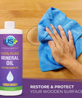 Hand applying Pure Mineral Oil for Cutting Boards and Food Prep Surfaces Legit Food Grade Kosher GMO Free Deep Penetrating Wood Protector