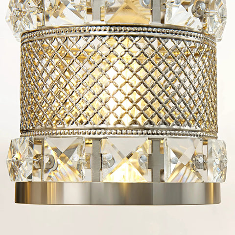 Close-up of crystal cylinder shade and brushed nickel detail on Over Mirror Four Bulb Bathroom Vanity Light With Cylinder Crystal Shade