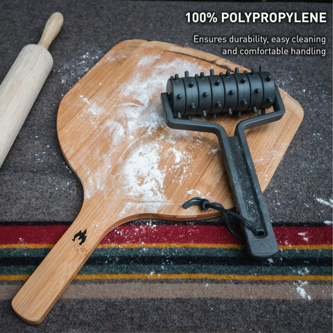 Black pizza docker on wood board, pizza peel, roller, Pizza Docker For Bubble Free Crust And Even Cooking Create Consistently Uniform Crust Elevate Your Home Pizza Game Essential Tool For Perfect Crispy Pies Durable Polypropylene Build.