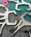 Workhorse 11 Inch Locking C Clamps 4 Pack Heavy Duty Steel With Swivel Jaw Pad One Hand Quick Release Mechanism on workspace.