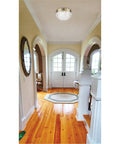 Two Light Flush Mount Ceiling Fixture With Clear Faceted Glass And White Finish in a bright hallway setting