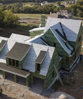 Top Shelf Synthetic Roof Underlayment Roll Covers 10 Squares Heavy Duty Waterproof Barrier on a new home under construction.