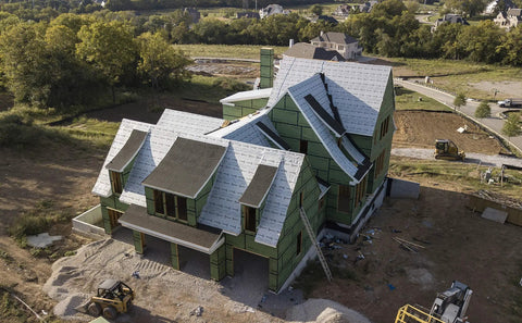Top Shelf Synthetic Roof Underlayment Roll Covers 10 Squares Heavy Duty Waterproof Barrier on a new home under construction.