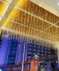 Warm White LED Icicle String Lights For Windows And Outdoor Spaces 16.4Ft 216 LEDs hanging on outdoor ceiling
