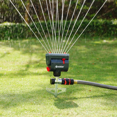 4-Way Adjustable Mini Turbo Oscillating Sprinkler With Step Spike Gear Drive for heavy-duty lawn watering system in use
