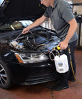Mechanic using ATF Sealed Fluid Extractor And Refill Kit For Auto Trans Fluids, 2.5 Gallon Capacity, all-in-one workhorse
