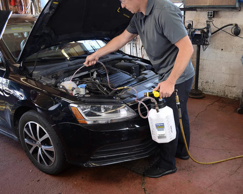Mechanic using ATF Sealed Fluid Extractor And Refill Kit For Auto Trans Fluids, 2.5 Gallon Capacity, all-in-one workhorse