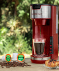 Red Single Serve Coffee Maker With 2 In 1 Brew Pod Or Ground Coffee Five Brew Sizes Up To 14 Oz No Fuss Quick Brew Fits Travel Mug With Adjustable Drip Tray Compact 1000W Coffee Brewer on kitchen counter with coffee cup and pods