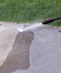 Beastly 2000 Max PSI Electric Powered Pressure Washer cleaning driveway, showing clear before and after results with 14.5 Amp Motor, 1.5 GPM.