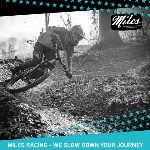 Mountain biker using Beefy Stainless 160mm Disc Brake Rotor for Shimano and SRAM on trail, showcasing crisp braking.