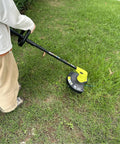 Person using No Fuss Replacement Bladed Head With Spool Line For Ryobi 18V 24V 40V Weed Eater Trimmers Fits RY40210 RY40210A on grass