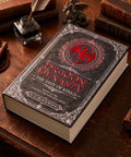 Gothic Fantasy Book Safe With Real Pages And Combo Lock Box on a desk, with crimson dragon crest and leather accessories.