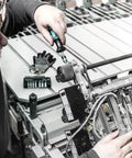 Person using Kraftform Torque Screwdriver Set With Rapidaptor Bitholder, 0.3-6.0 Nm, 27 Pieces on machinery for precise adjustments.