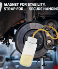 Dreyoo 16oz brake bleeder bottle kit; white plastic bottle with yellow hose mounted to car disc brake