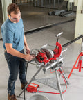 Model 300 Power Drive Complete Pipe Threading Machine, 38 RPM, in use threading pipe, includes stand, tray, and accessories.