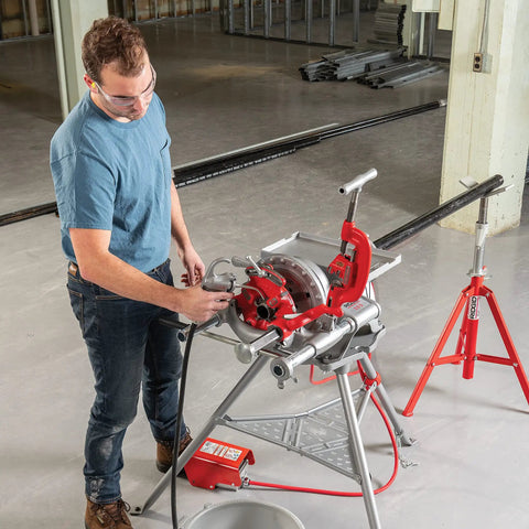 Model 300 Power Drive Complete Pipe Threading Machine, 38 RPM, in use threading pipe, includes stand, tray, and accessories.
