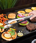 Griddle Tool Kit For Outdoor And Indoor Grillin Grilling Heat Resistant Stainless Steel BBQ Utensils Including tongs in use