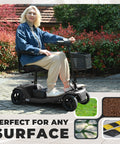 Front view of Metro Mobility four-wheel powered mobility scooter in black with front basket; user seated outdoors.