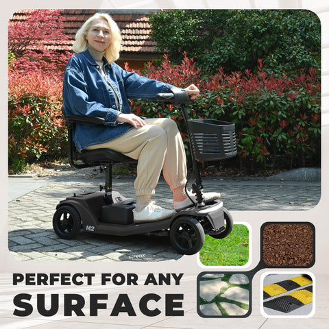 Front view of Metro Mobility four-wheel powered mobility scooter in black with front basket; user seated outdoors.