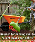 Person using Leaf Grabber Rake With Long Handle And Cushioned Grip For Leaves Lawn Clippings Twigs And Yard Waste beside wheelbarrow