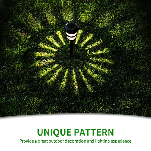 8 Pack Solar Pathway Lights With Twin Ring LED Design for bright auto on at dusk, showing unique light pattern on grass.