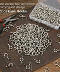 Heavy Duty Screw Eye Hooks 1 Inch Self Tapping Eye Bolts for Wood Ideal DIY Arts and Crafts Projects Indoor Outdoor Hanging Artwork Photos Wind Chimes Lights More 100 Pieces displayed with open storage box and pliers on a leather surface
