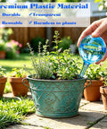 Person inserting 12 Pack Large Plant Watering Globes Self Watering Bulbs For Indoor And Outdoor Pots Refillable Transparent Plastic Garden Watering Devices For Easy Hassle Free Plant Care While You're Away into plant pot
