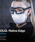 Person wearing anti-fog safety goggles with clear lens and adjustable elastic headband, showcasing blue protective eyewear.