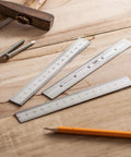 Pro Grade Machinist Ruler Set, 6 Inch Stainless Steel With Metric And Imperial Markings on a wooden surface with tools